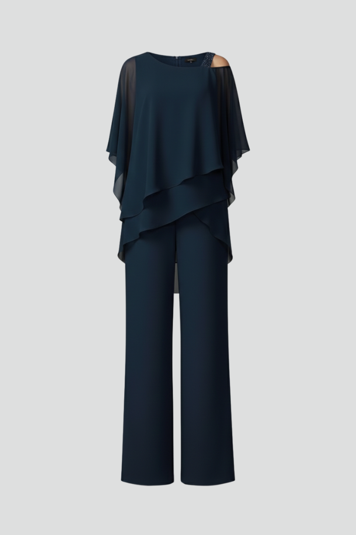 Women's cold-shoulder wide-leg jumpsuit, flowing fabric. Effortless summer style, comfortable & modern.