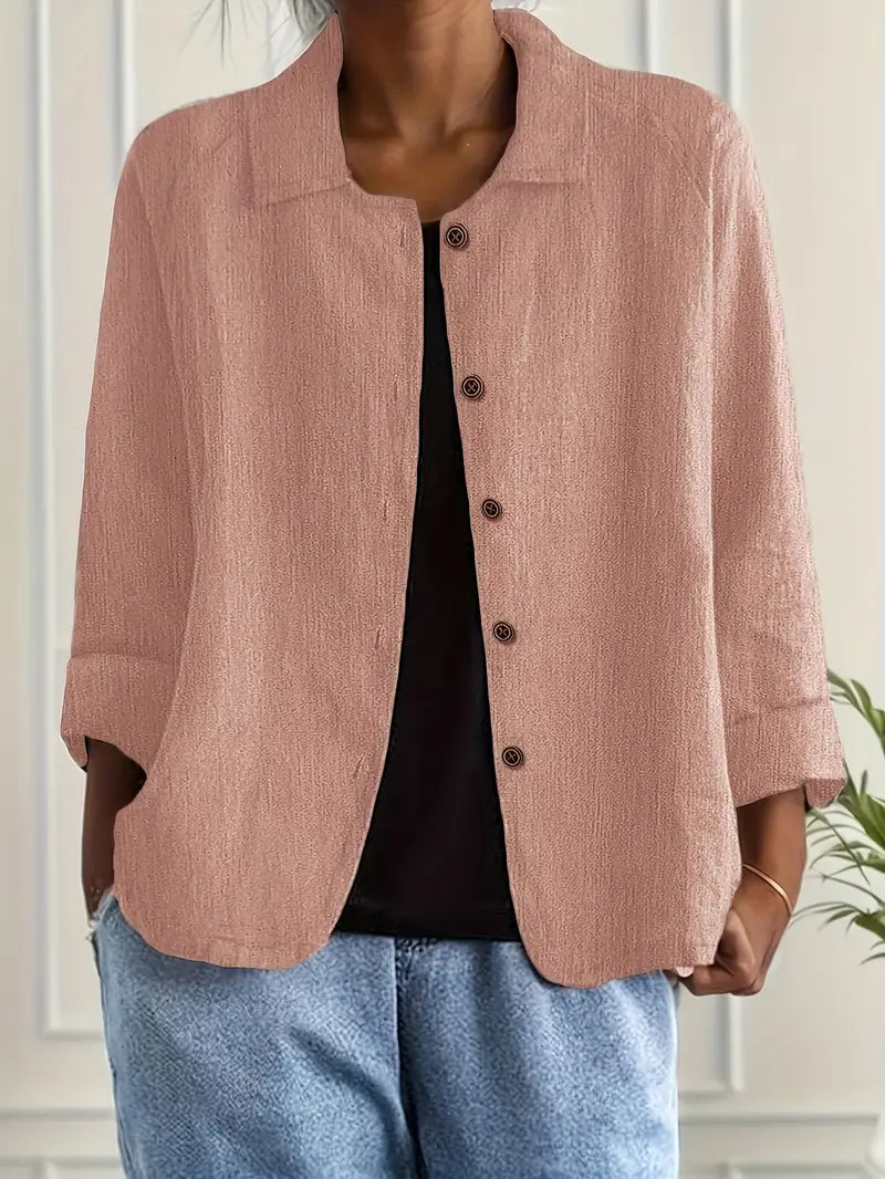 Stylish women's 3/4 sleeve button-front blouse. Perfect for smart casual outfits and everyday fashion.