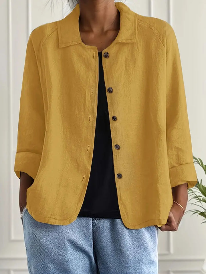 Women's workwear blouse. Collared, button down, and three-quarter sleeves offer a professional yet stylish option.