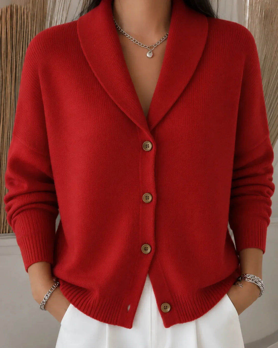 Vibrant red women's collared button-front cardigan sweater. Elegant long-sleeve knit for versatile casual wear.