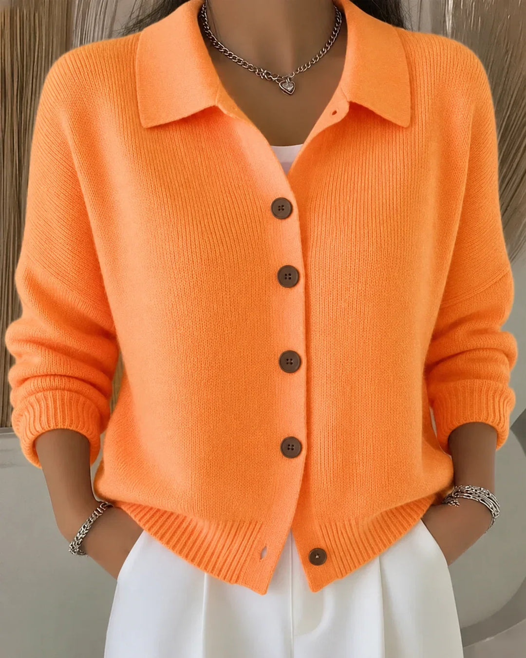 Women's collared button-front cardigan sweater. A versatile, long-sleeve layering top for elegant casual wear.