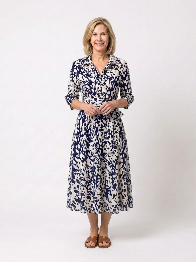Women's collared long sleeve midi dress with waist tie. Elegant and comfortable for everyday wear.