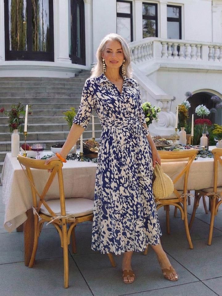 Chic women's collared midi dress with long sleeves and an adjustable waist tie, perfect for versatile fashion.