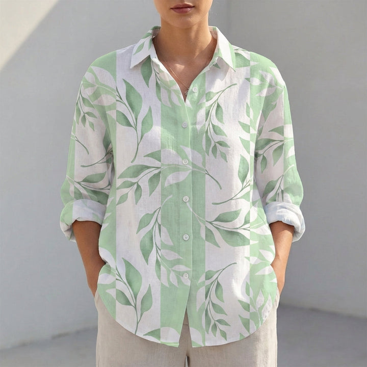 Casual V-neck tunic blouse for women featuring a classic collar and adjustable roll-tab sleeves.