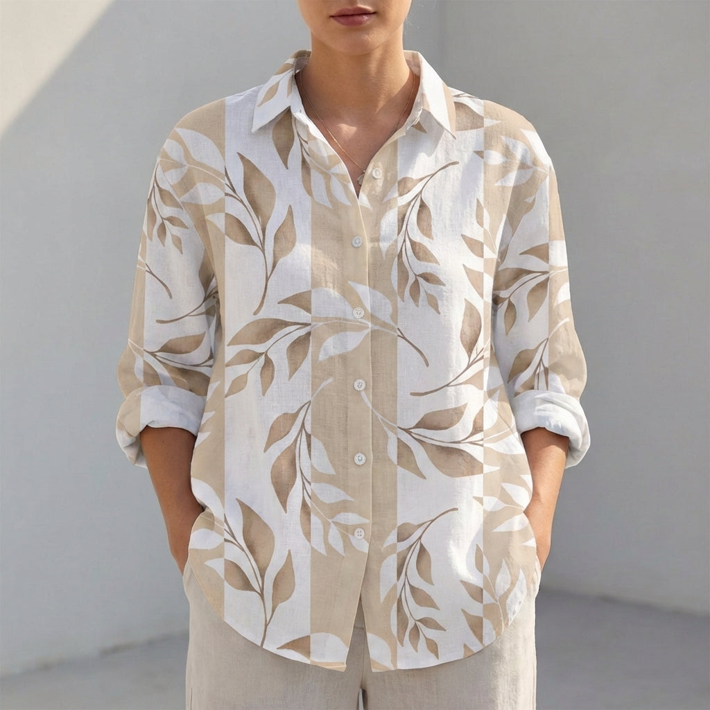 Patterned V-neck collared shirt, perfect as a beachwear cover-up or a chic daytime outfit.