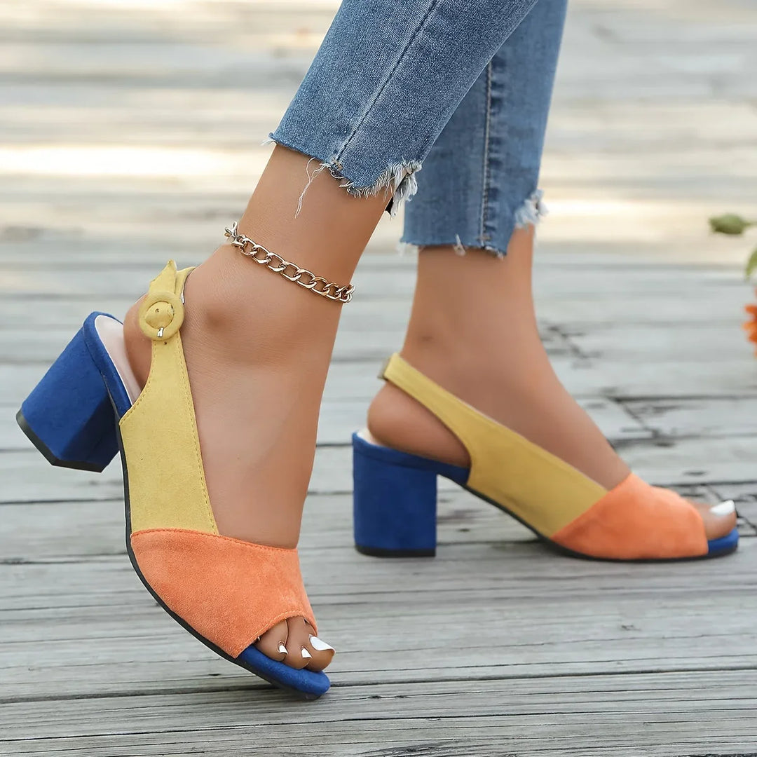 Stylish women's heeled sandals featuring a vibrant color-block design and comfortable open toe.