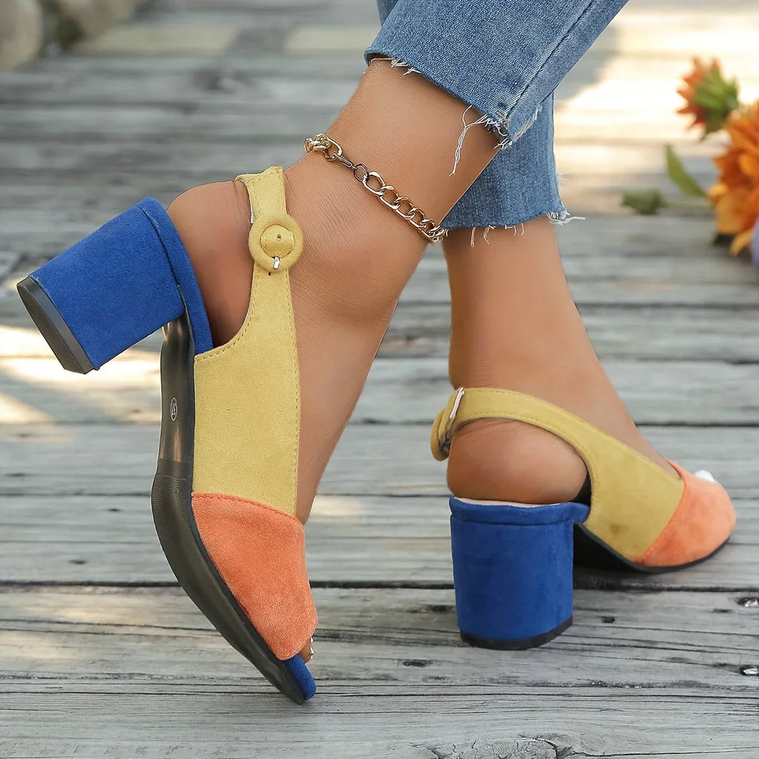 Close-up of women's color-block block-heel sandals, showing open-toe design & secure slingback.