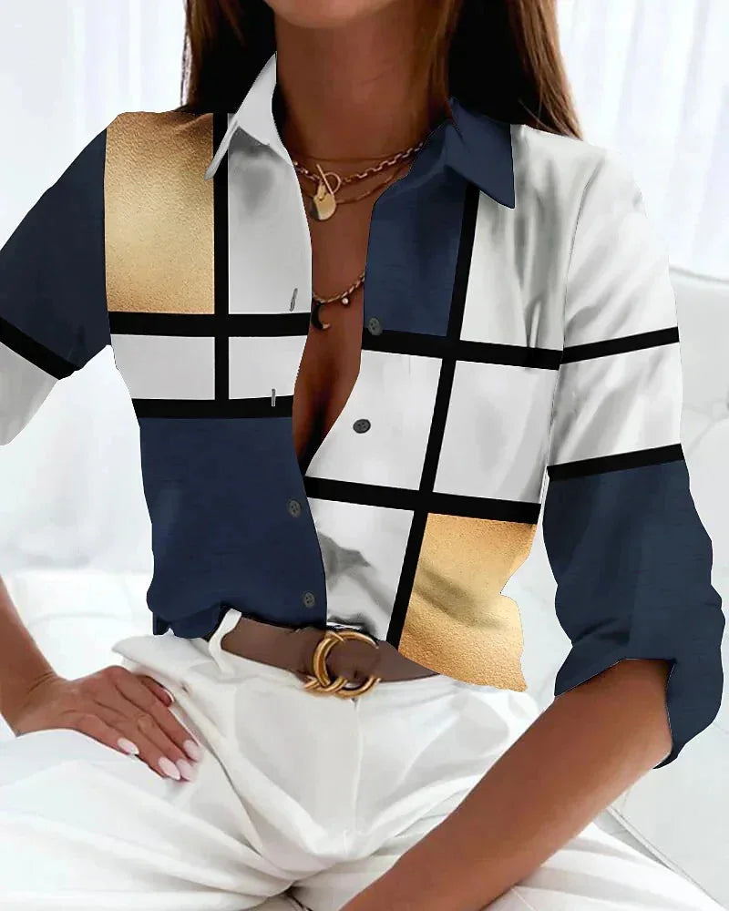 Women's color-block printed blouse with 3/4 sleeves and button-down front. Perfect for work or casual wear.
