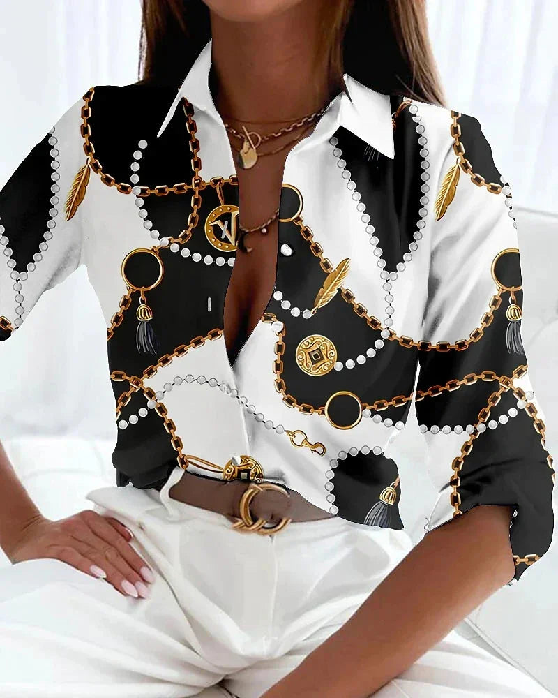Modern women's printed color-block blouse with comfortable 3/4 sleeves and elegant button-down detail.