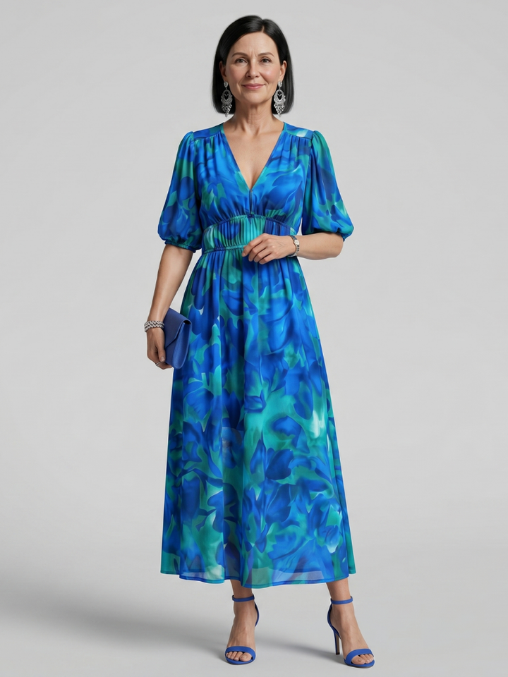 Women's colorful abstract print midi dress with chic puff sleeves and V-neck, perfect for summer fashion.