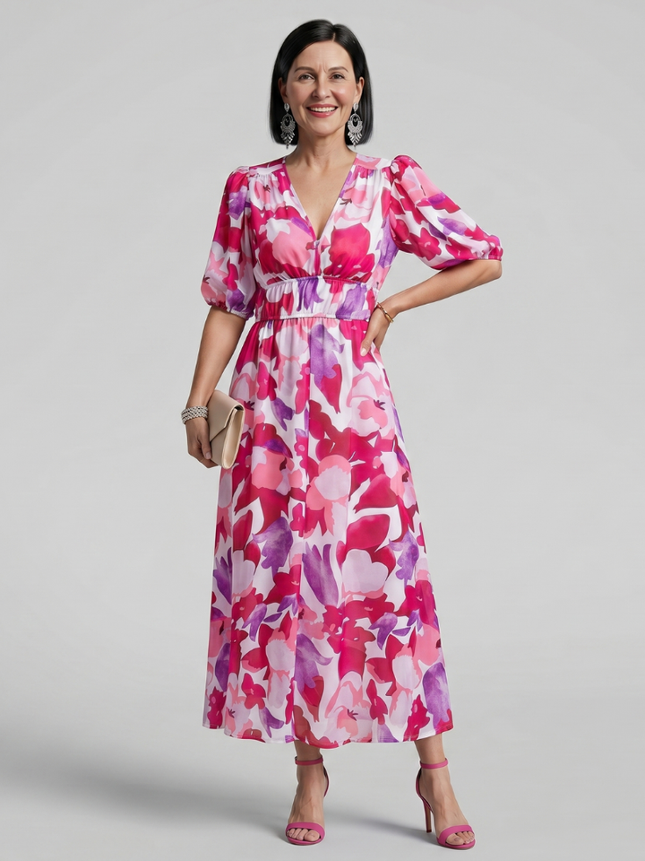 Vibrant abstract print women's midi dress with fashionable puff sleeves and flattering V-neckline.