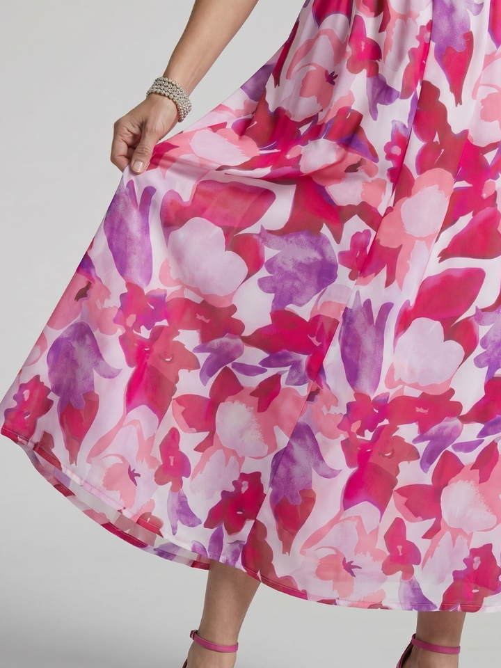 Chic women's puff sleeve midi dress, a colorful abstract print design for elegant summer fashion.