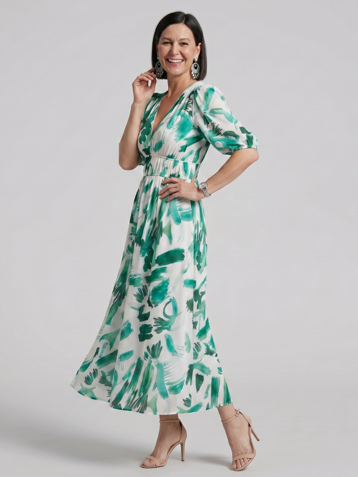 Fashionable women's abstract print puff sleeve midi dress, a versatile V-neck for day or evening wear.
