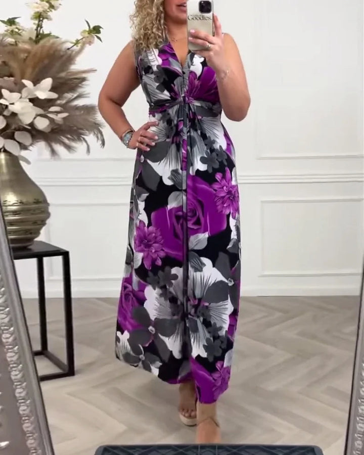 Vibrant summer floral maxi dress, sleeveless, V-neck with tie-front. A flowing, elegant long dress for vacation.