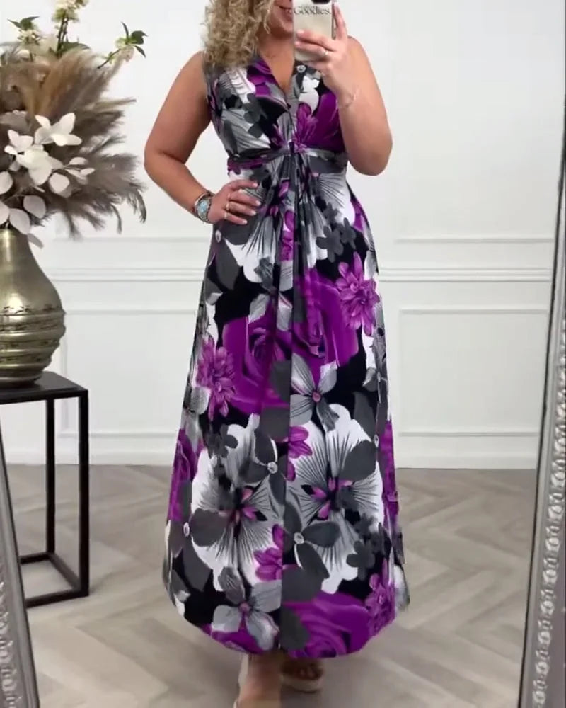 Women's sleeveless V-neck floral maxi dress with a tie-front detail. A colorful and flowing long summer dress.