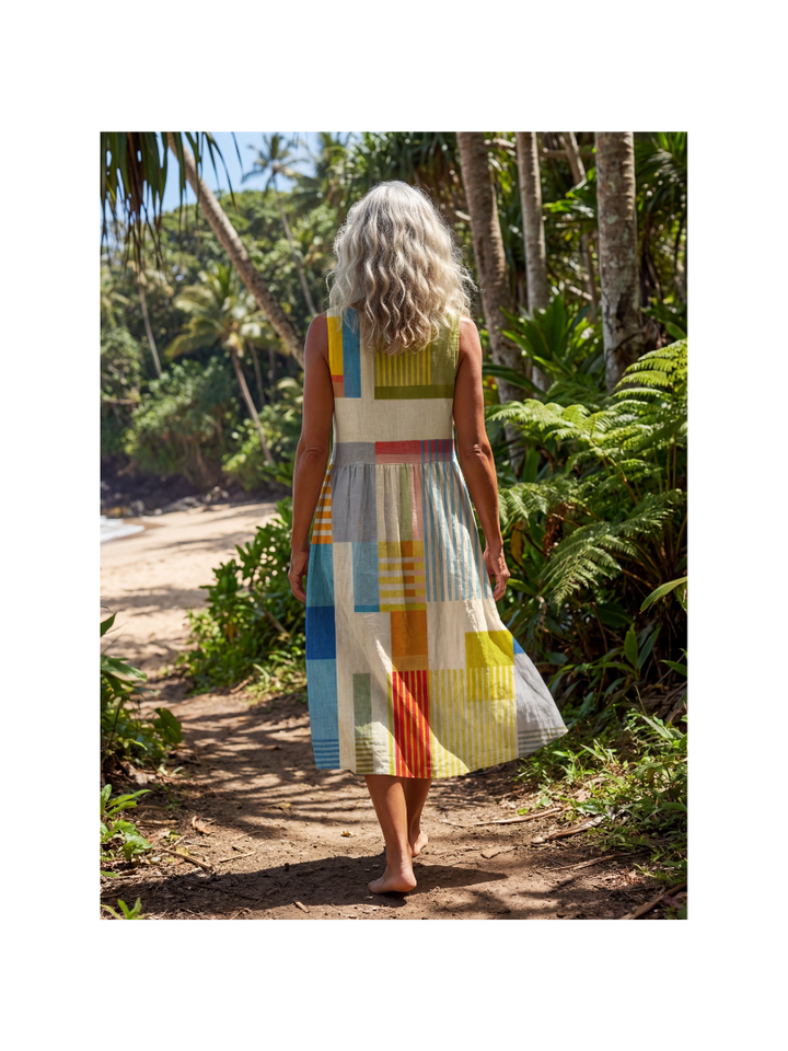 Close-up of a women's colorful painted block midi dress, showing intricate patchwork and relaxed fit.