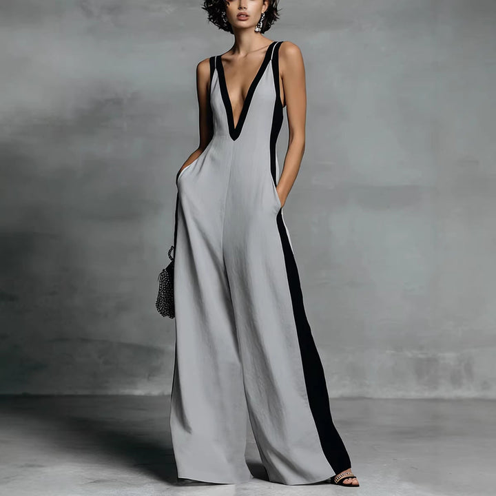 Effortless women's colour-block wide-leg jumpsuit. Sleeveless V-neck one-piece, ideal for elegant smart-casual occasions.