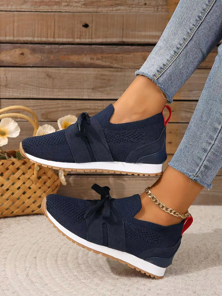Soft, lightweight women's comfort-fit walking sneakers with breathable fabric for active casual footwear.