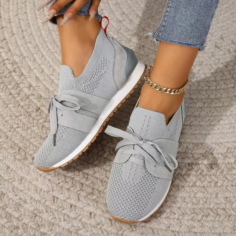 Women's comfort-fit lightweight walking sneakers with supportive sole for active and casual wear.