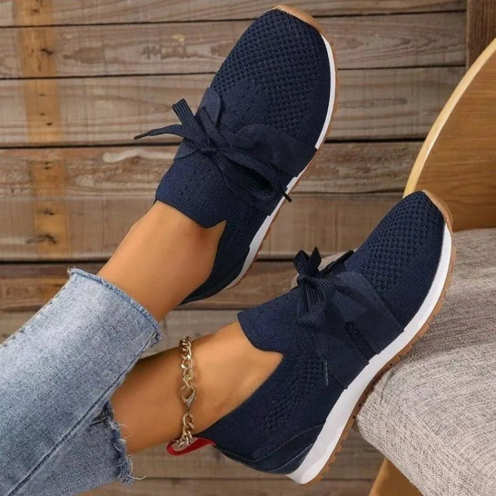 Women's lightweight walking sneakers, comfort-fit design for breathable and active daily wear.