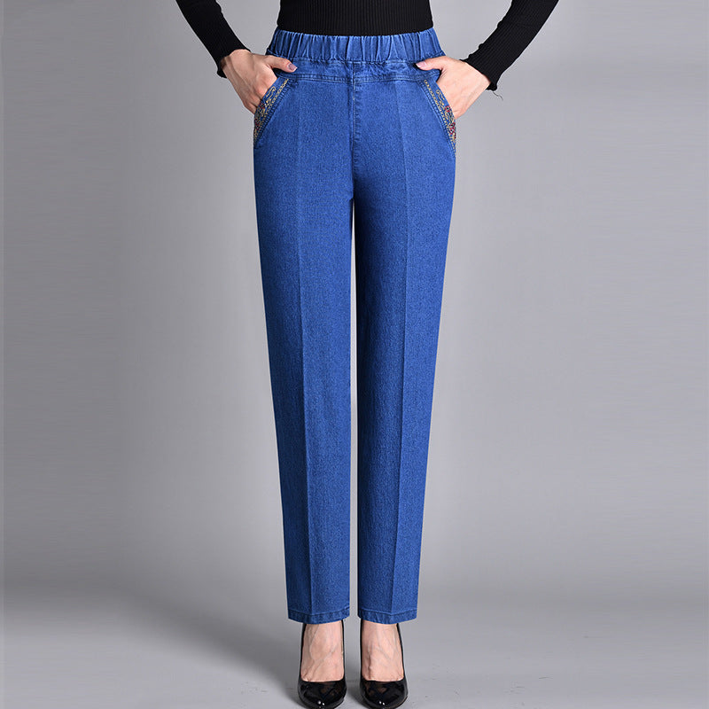 Women's comfort-fit straight-leg jeans with elastic waistband & side pockets. Perfect for everyday casual wear.