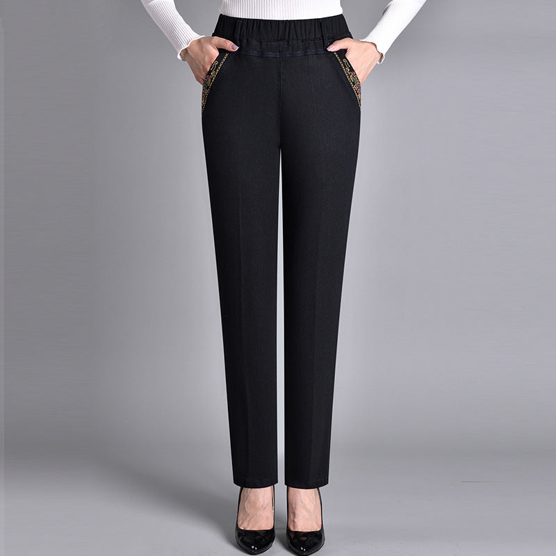 Women's comfort-fit jeans with practical side pockets & elastic waist. Straight-leg denim for all-day wear.