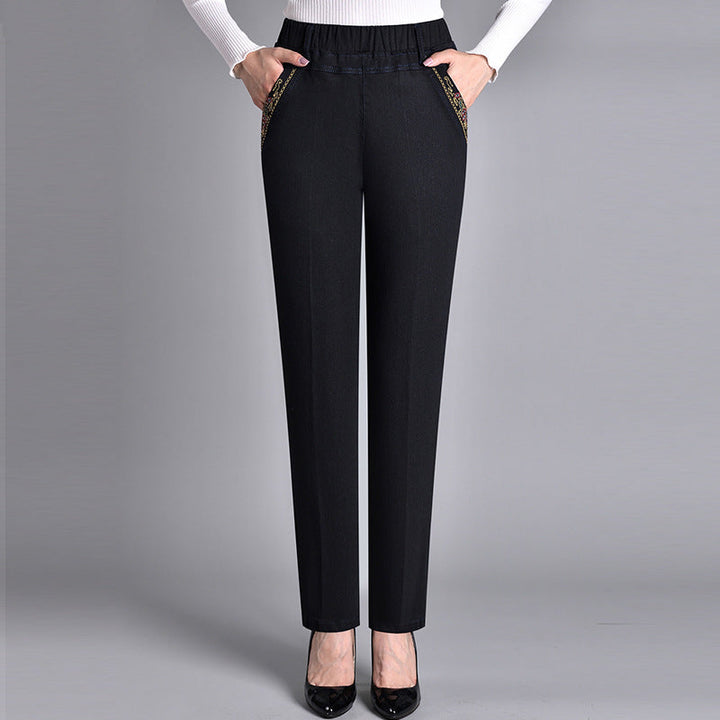 Women's comfort-fit jeans with practical side pockets & elastic waist. Straight-leg denim for all-day wear.