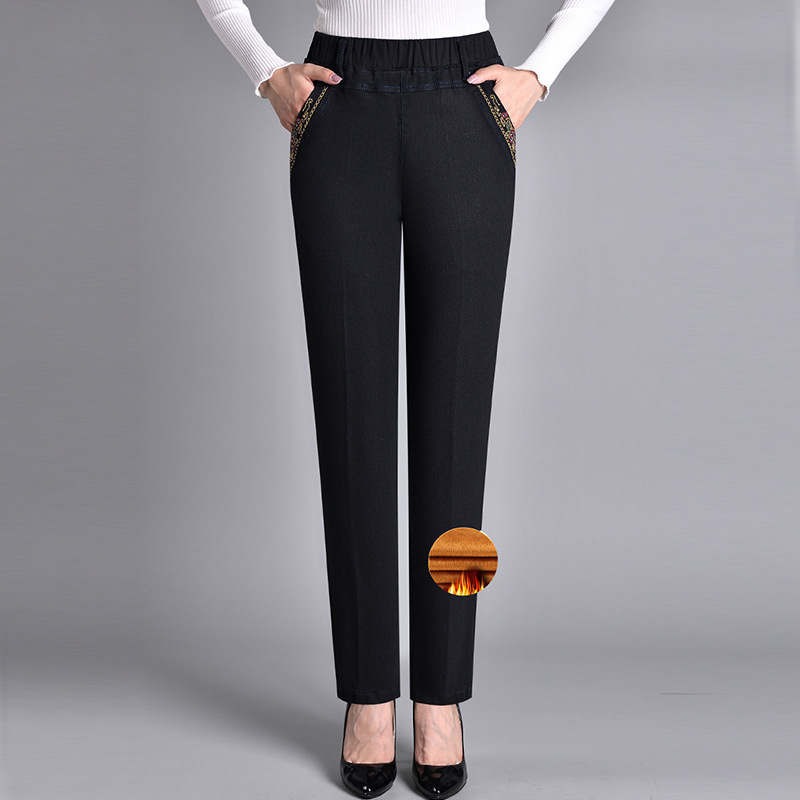 Women's straight-leg denim jeans featuring an elastic waistband, side pockets, & comfort fit. Everyday style.