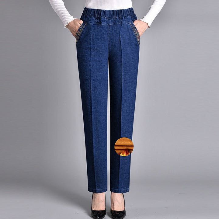 Soft denim comfort-fit jeans for women with elastic waistband, straight leg, & side pockets. Casual & cozy.