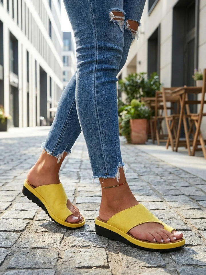 Fashionable women's comfort sandals, toe-post design with essential arch support.