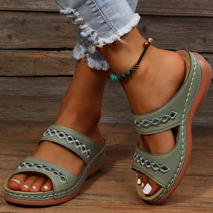 Women's casual slide sandals featuring orthopedic arch support, comfortable design, and summer style.