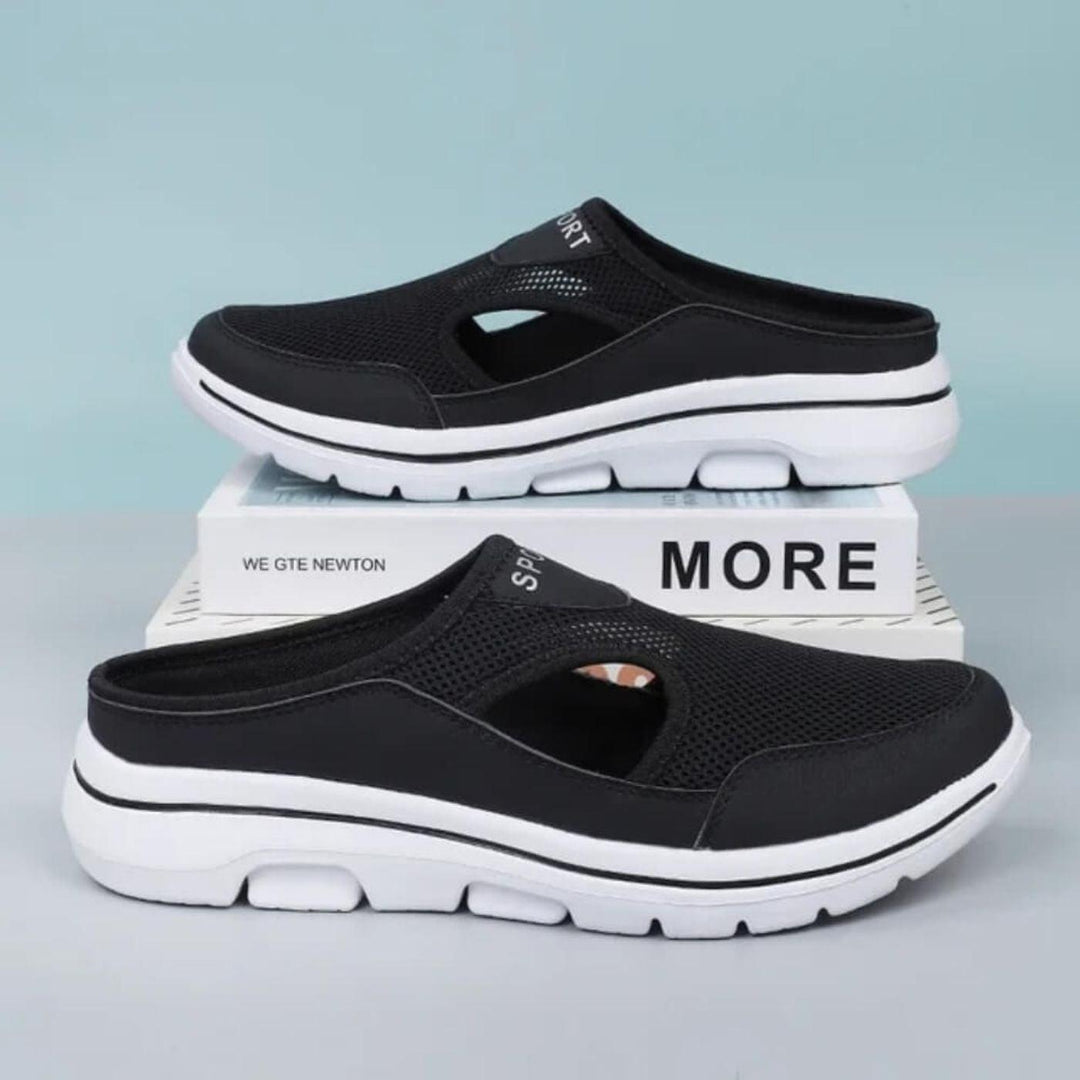 Top-down view of women's comfortable slip-on sandals with elegant cutout details for summer.