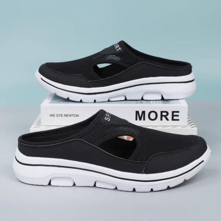 Top-down view of women's comfortable slip-on sandals with elegant cutout details for summer.
