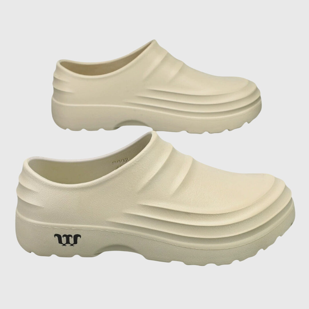 Black women's flexible orthopedic sandals offering arch support & foot pain relief for active comfort.