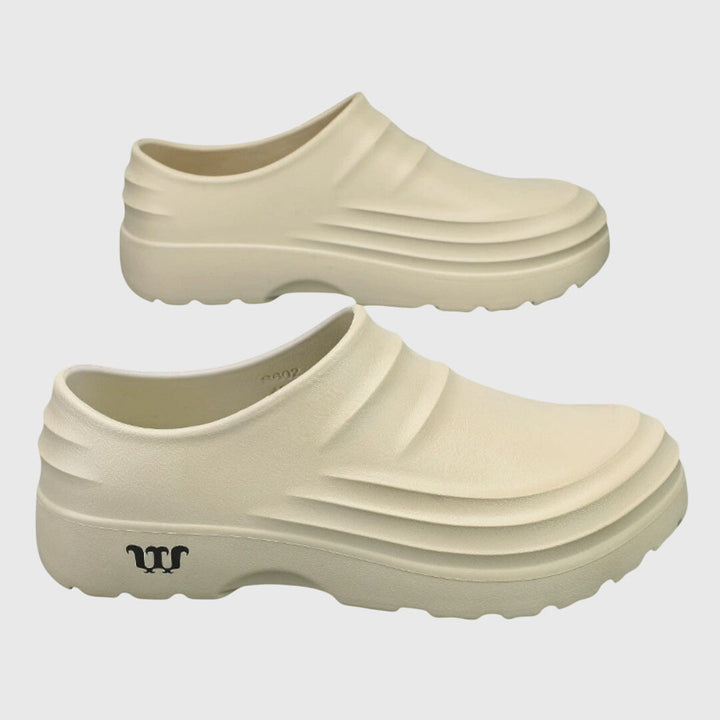 Black women's flexible orthopedic sandals offering arch support & foot pain relief for active comfort.