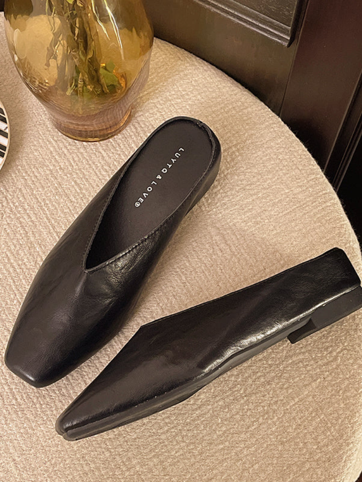 Elegant brown women's flat slip-on shoes with a rounded toe, perfect for comfortable and versatile everyday style.