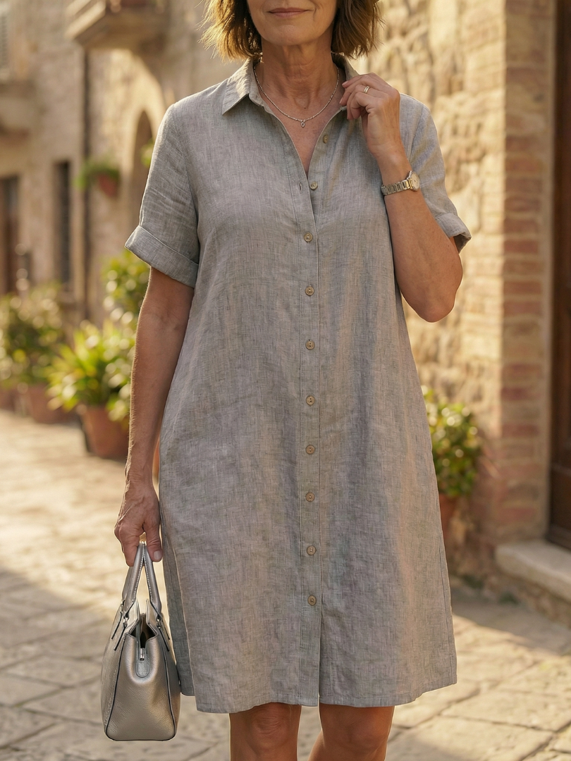 Stylish women's button-front short-sleeve knee-length dress in a relaxed fit, ideal for casual summer days.