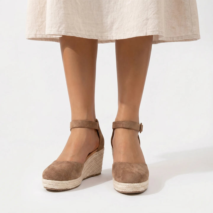 Comfort-focused women's closed toe wedge sandals with ankle strap. Ideal platform summer shoes for elegant daily wear.