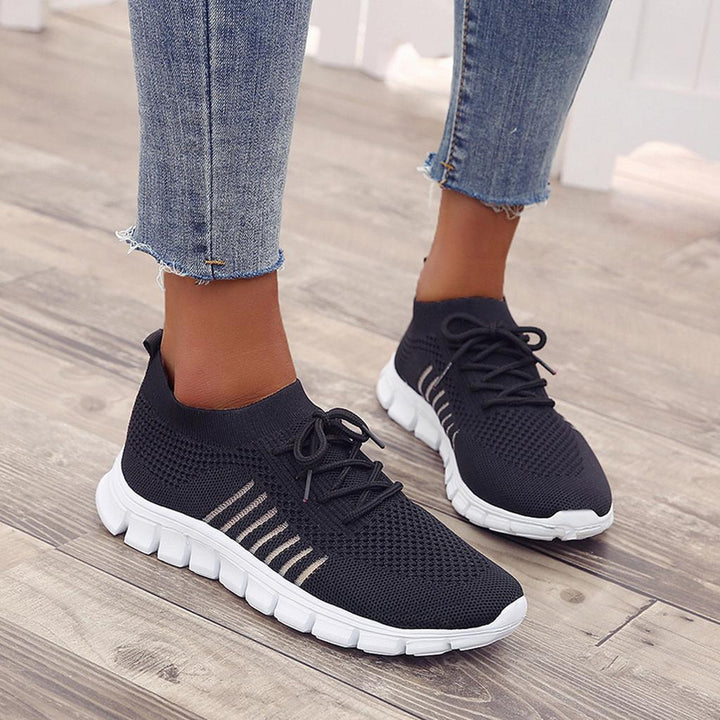 Close-up of the breathable fabric on women's comfortable everyday sneakers.