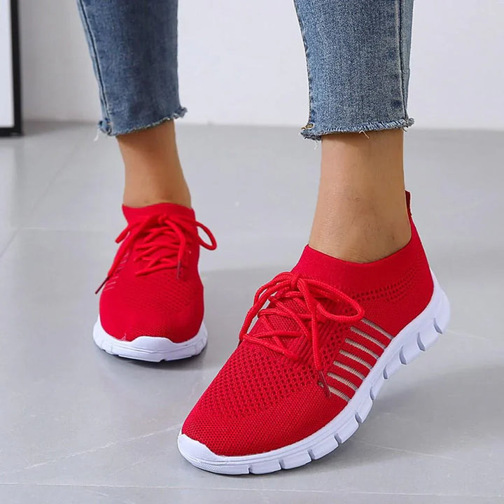 Side view of new women's sneakers, emphasizing comfort and lightweight feel.