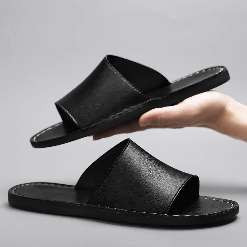 Textured women's flat sandals with an open toe, ideal for comfortable slip-on summer wear & chic everyday style.
