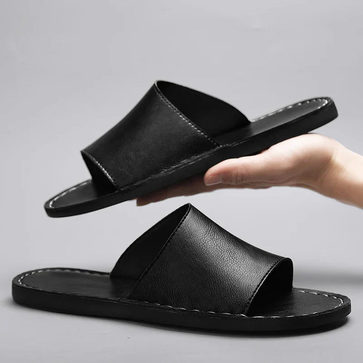 Textured women's flat sandals with an open toe, ideal for comfortable slip-on summer wear & chic everyday style.