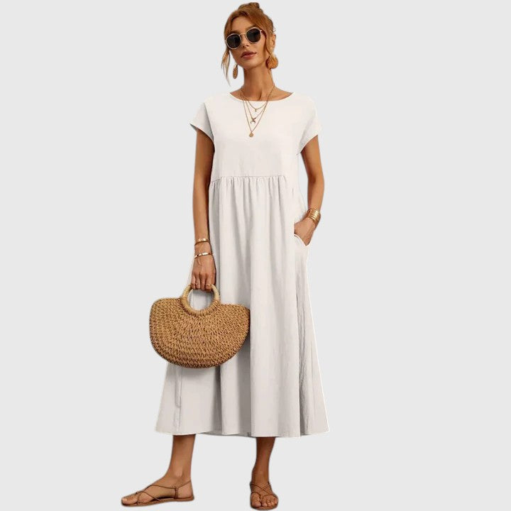 Short sleeve flowy midi dress for women. Comfortable summer style, ideal for casual everyday wear.