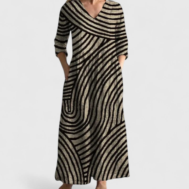 Elegant Women's Arabella midi dress. Stylish geometric print, V-neck, & pockets for comfortable casual wear.