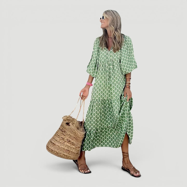 Women's comfortable green tiered maxi dress with elegant design, perfect for summer vacations. Long balloon sleeves.