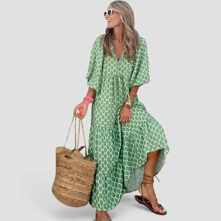 Elegant tiered maxi dress for women in green. Features comfortable fabric & stylish balloon sleeves, ideal for summer wear.