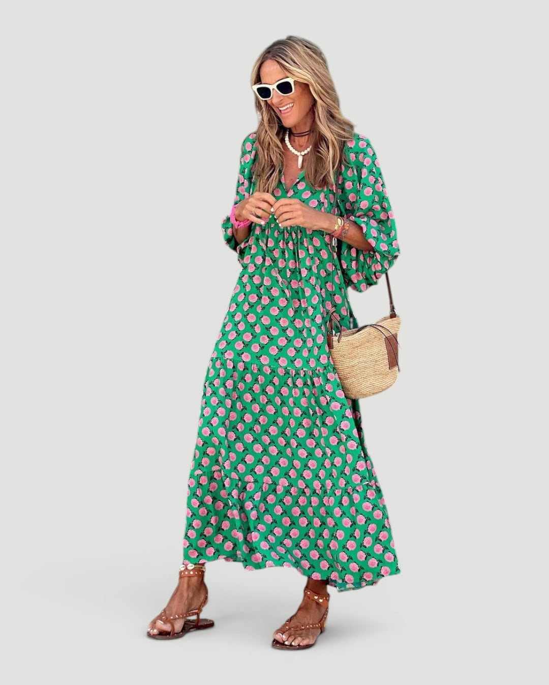 Comfortable women's green maxi dress, tiered for elegance. Ideal summer & vacation wear. Long, flowy silhouette.