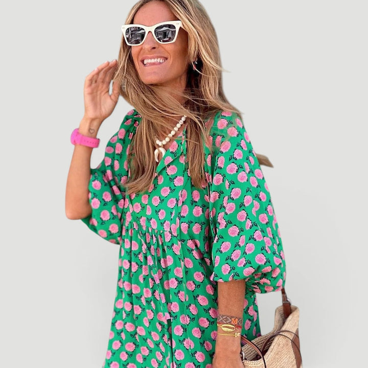 Flowy, elegant green tiered maxi dress for women. Comfortable fit with long balloon sleeves, perfect for summer & vacation.