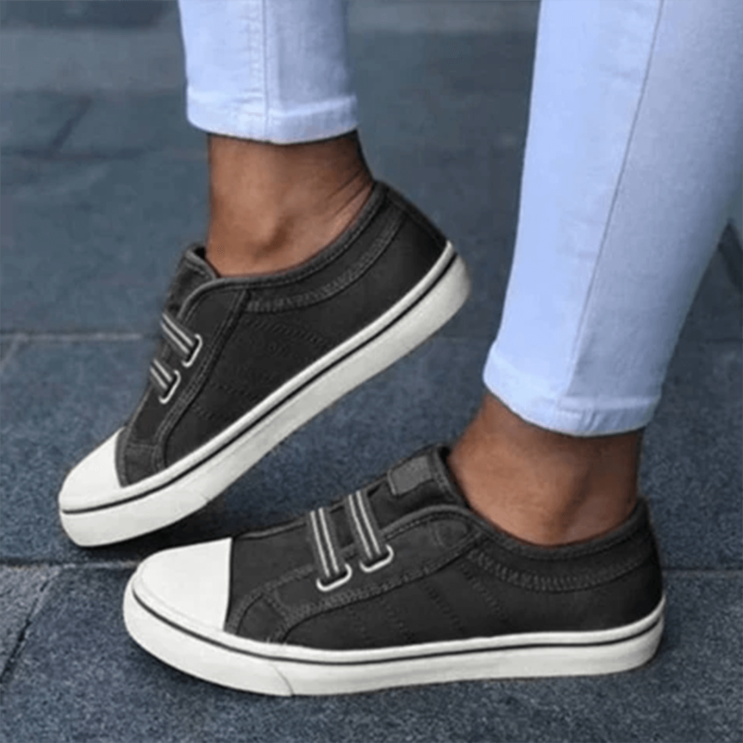 Women's comfortable grey slip-on trainers, perfect for everyday casual walking and style.