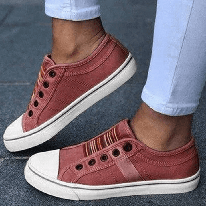Lightweight women's slip-on trainers, designed for comfortable walking and casual athletic activities.